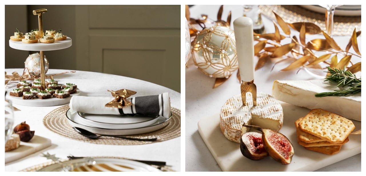 Elegant nyårsdukning i vitt och guld med porslin, servetter och festliga dekorationer på ett dukat bord.