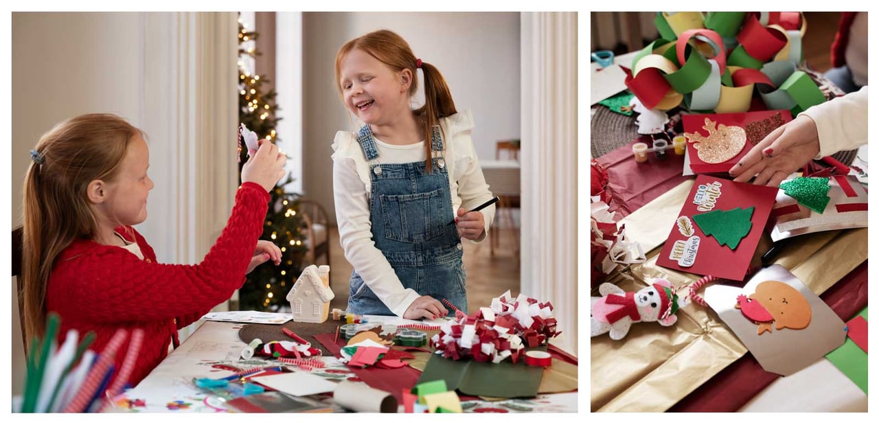 Zwei Kinder basteln Weihnachtsschmuck an einem Tisch. Daneben sind Weihnachtskarten und buntes Bastelmaterial zu sehen.