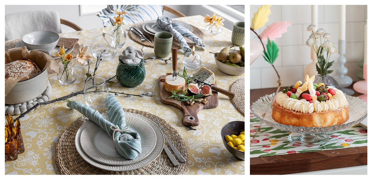 Gedeckter Tisch mit Osterthema und buntem Kuchen mit Zuckerguss, Erdbeeren und Süßigkeiten auf einer Glasplatte.