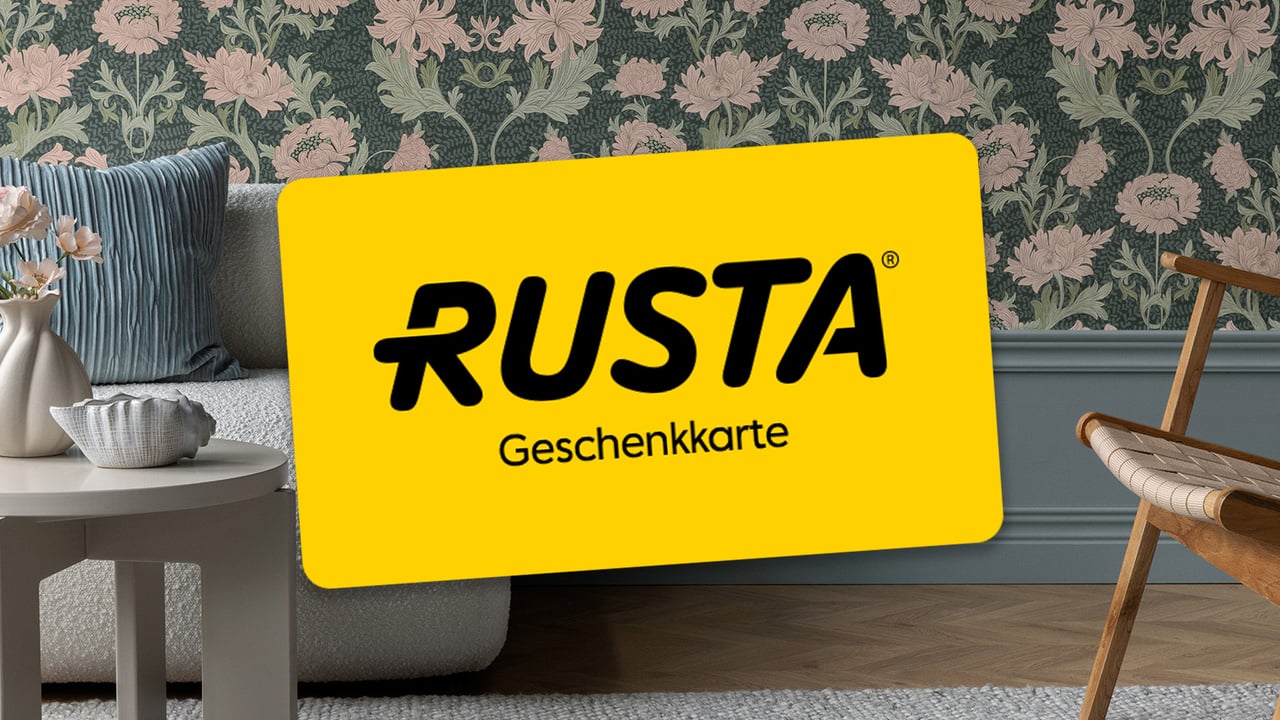 Gelber Geschenkgutschein mit dem Rusta-Logo in Schwarz.