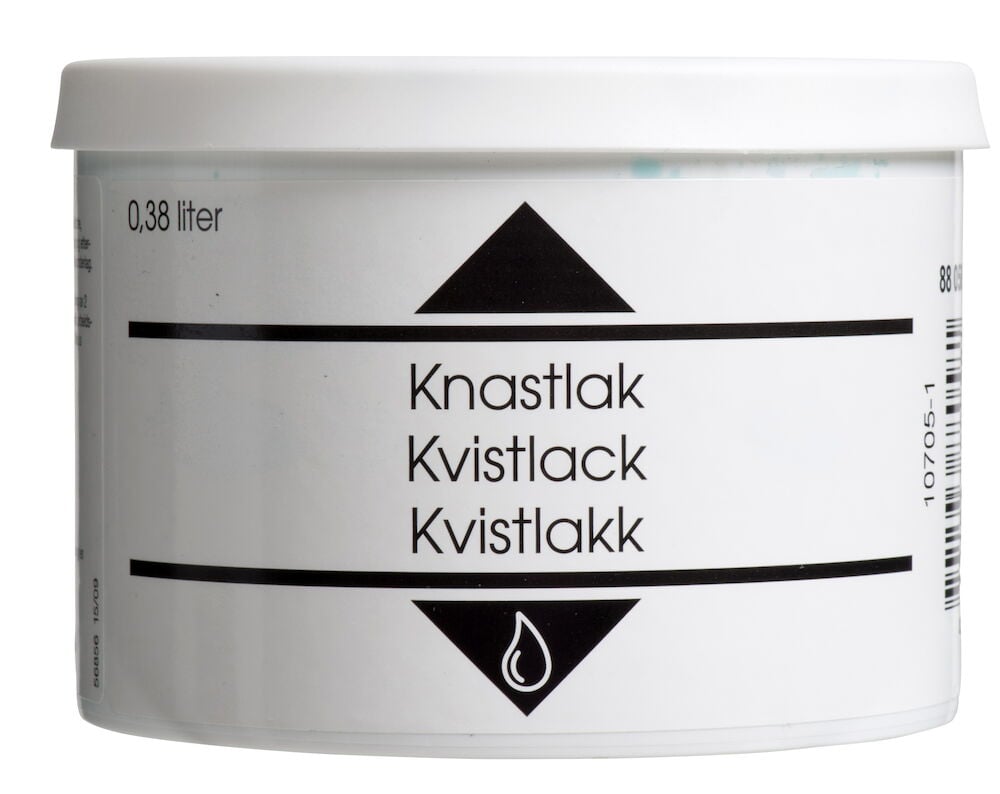 Grön kudde med fransar.