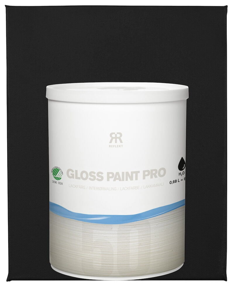 Valkoinen maalipurkki mustaa taustaa vasten.