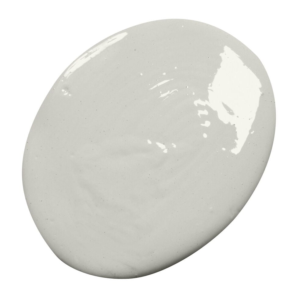 Vaaleanharmaa kiiltävä väriläiskä valkoisella taustalla.