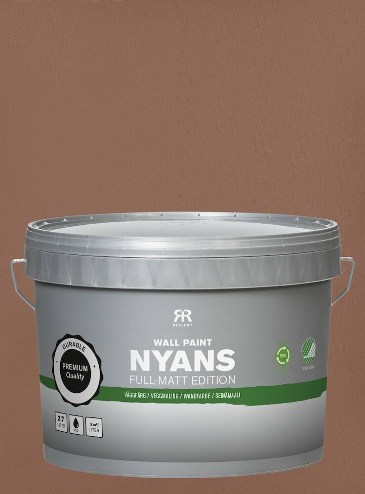 Grå burk väggfärg framför brunmålad vägg.