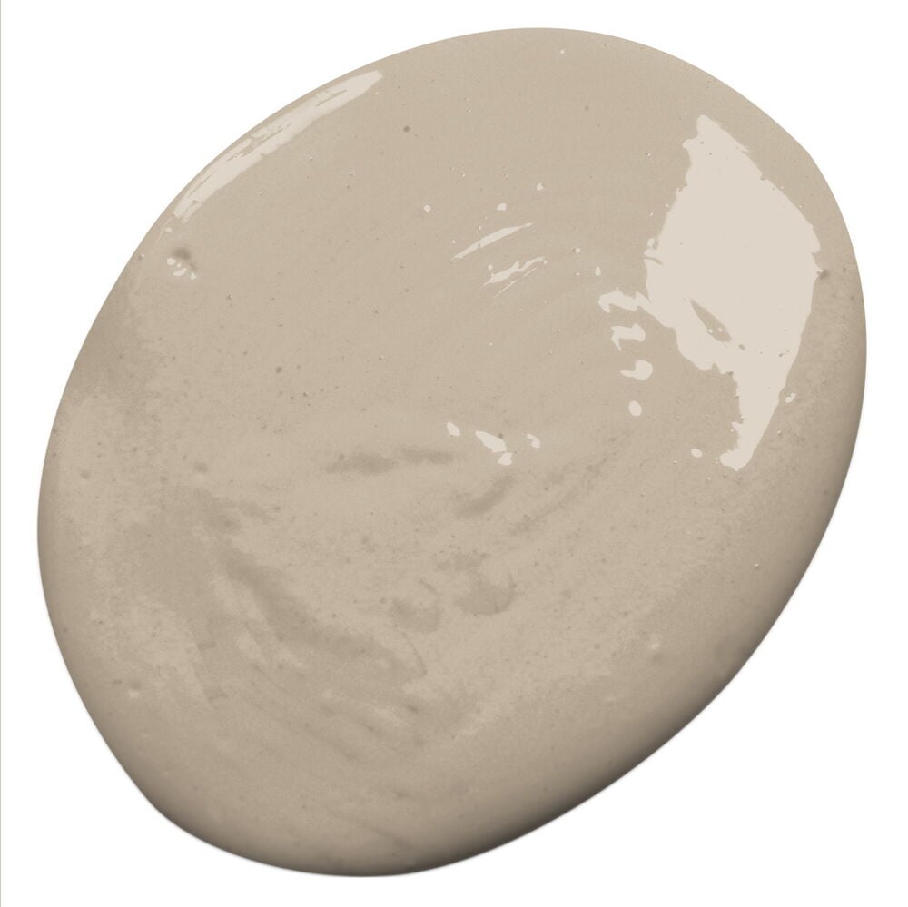 En oregelbundet formad klick sandfärgad väggfärg med glansiga och texturerade ytor.