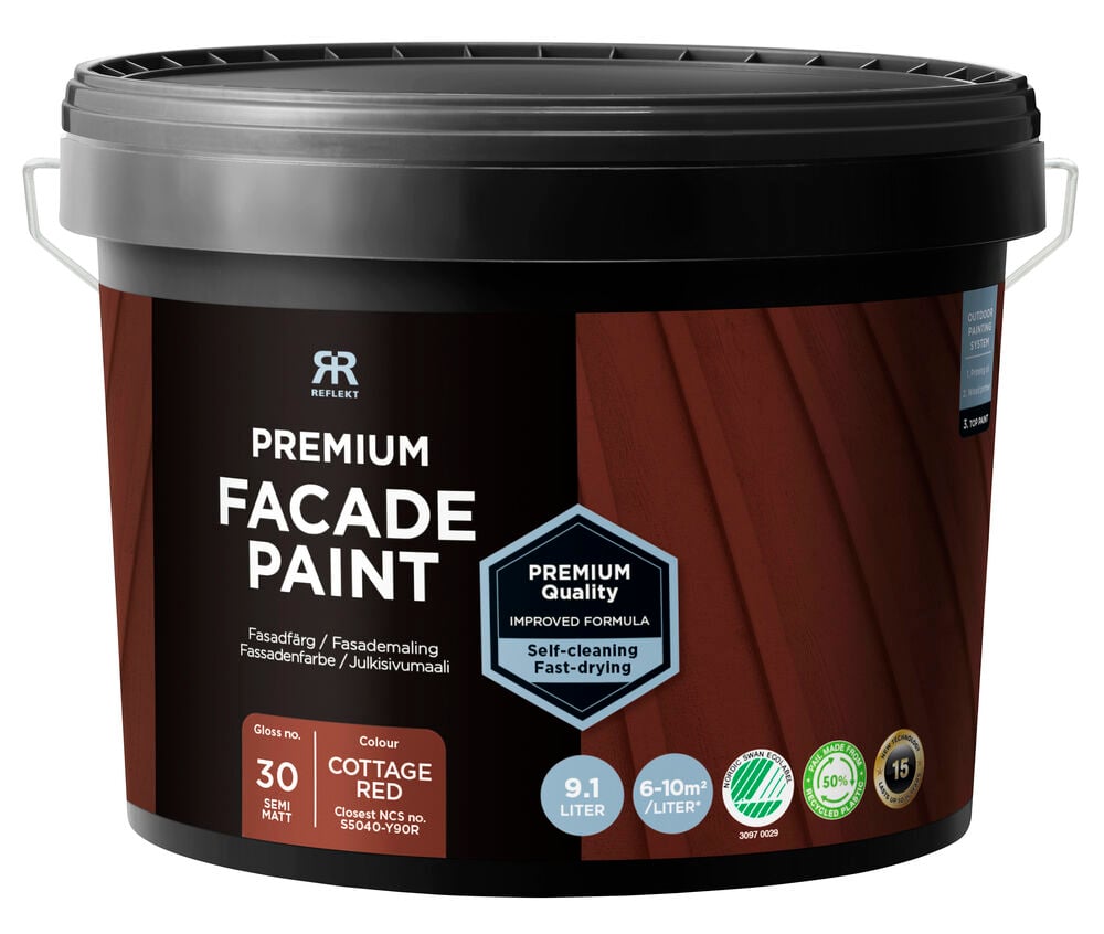 Svart hink med röd fasadfärg från Rusta.