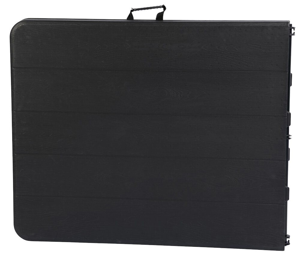 Hopfällt svart bord med bärhandtag syns framifrån.