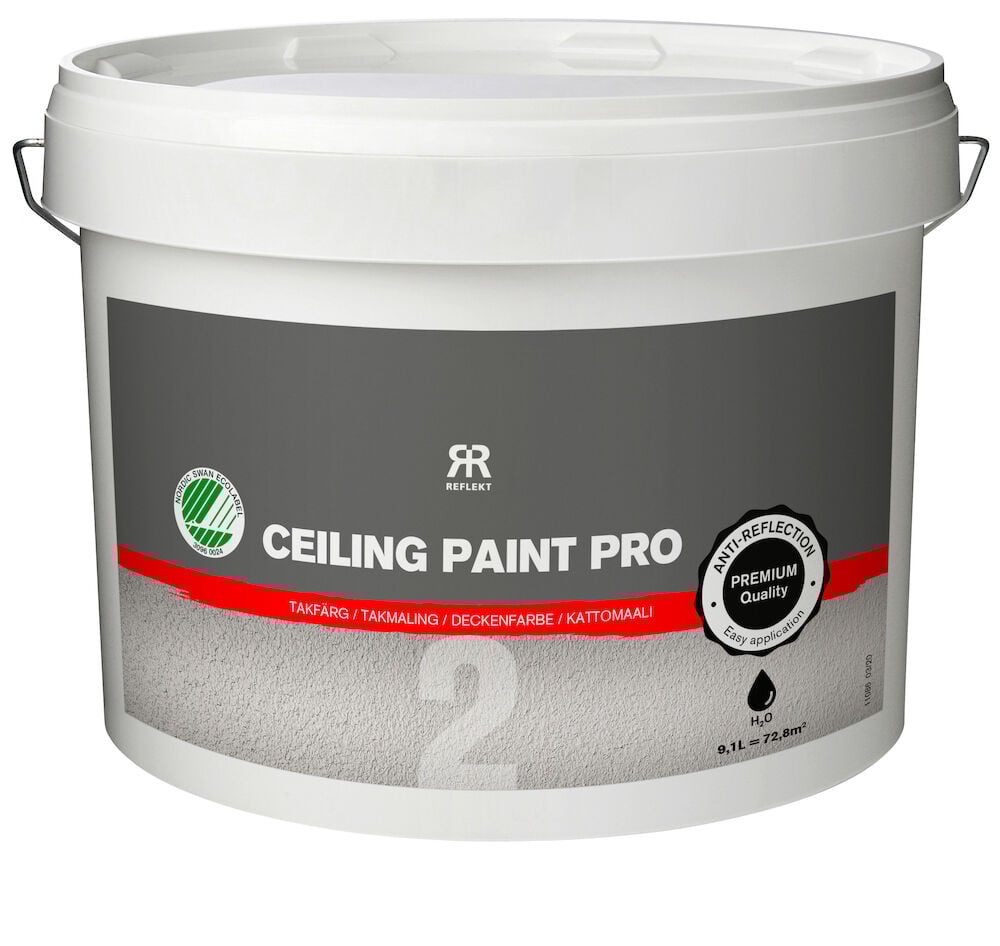 Vit plasthink med etikett för takfärg inomhus.