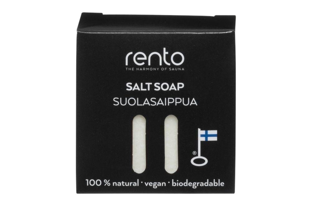 Musta kartonki, jossa valkoinen suolasaippua ja Suomen lippu.