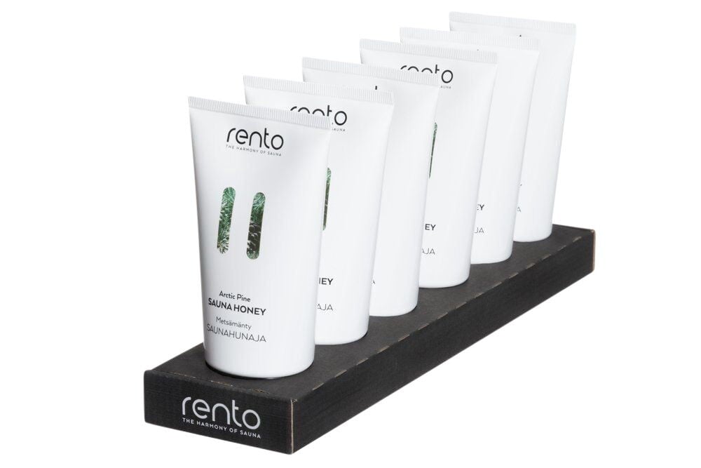 Kuusi valkoista putkiloista saunahunajaa mustalla telineellä.