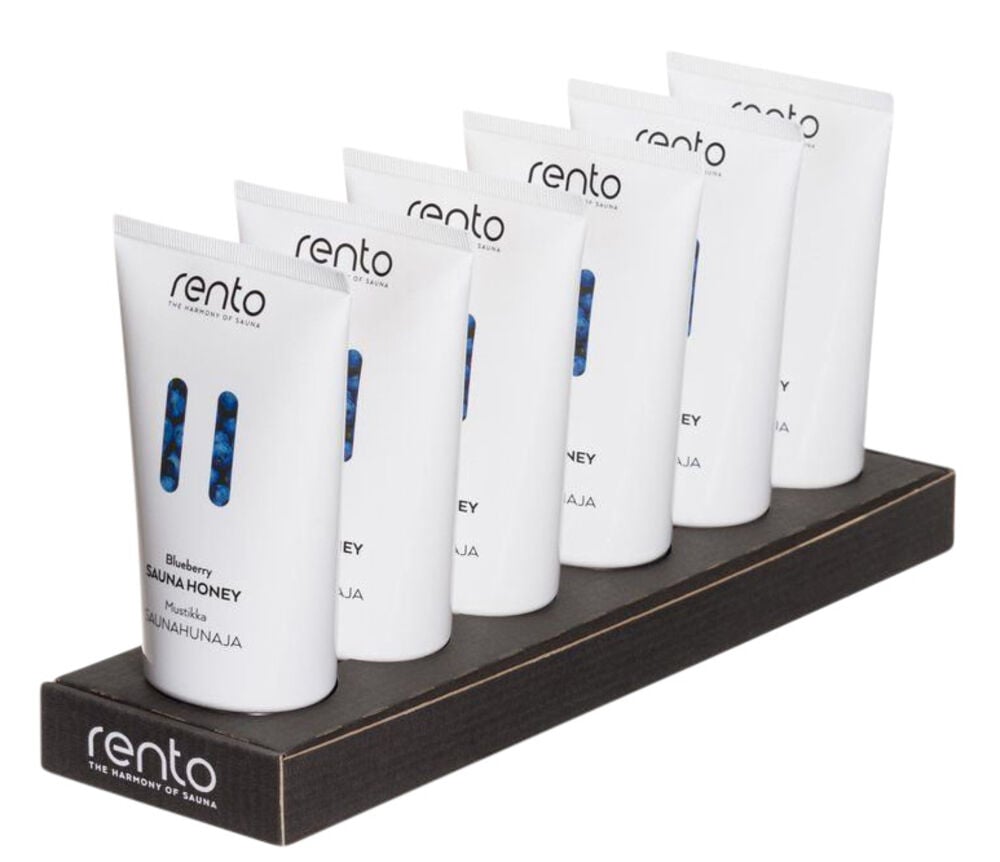 Kuusi valkoista sauna-hunajaputkea mustalla telineellä.