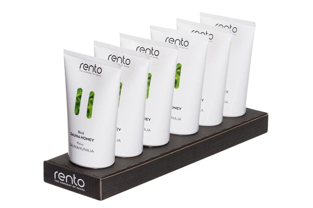 Kuusi valkoista saunahunajaputkea mustassa telineessä.