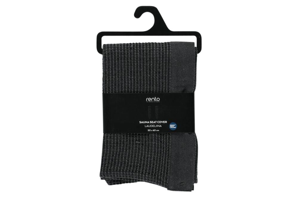 Musta ja harmaa saunapyyhe taitettuna pakkaukseen.