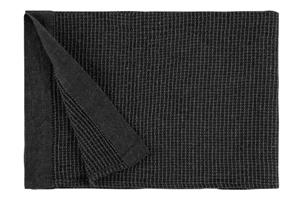 Musta-harmaa saunapyyhe taitetulla kulmalla, rakenteellinen kuvio.