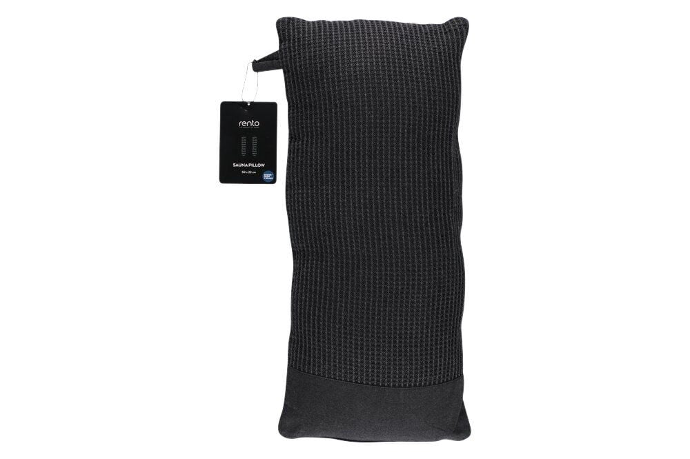 Musta ja harmaa saunatyyny teksturoidulla pinnalla.