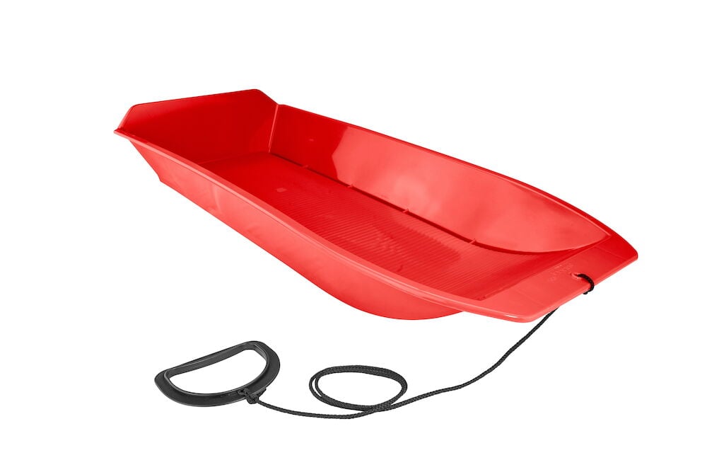 Punainen pulkka mustalla vetokahvalla näkyy kuvassa.