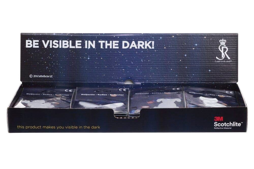 Musta näyttölaatikko, jossa useita pakkausheijastineläimiä.