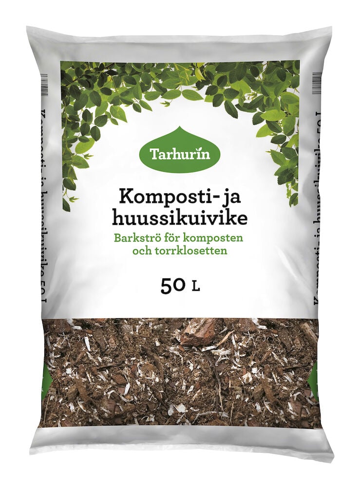 Valkoinen pussi kuoriketta kompostiin ja kuivakäymälään.