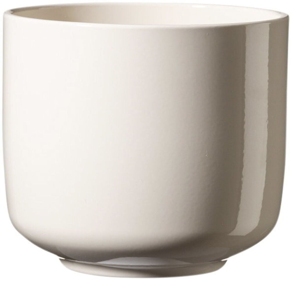 Pyöreä valkoinen keraaminen ruukku kiiltävällä pinnalla.