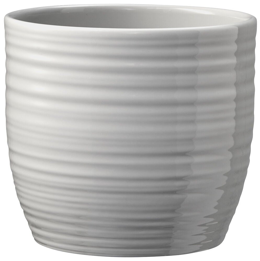 Harmaanbeige lasitettu ruukku, jossa vaakasuorat raidat.