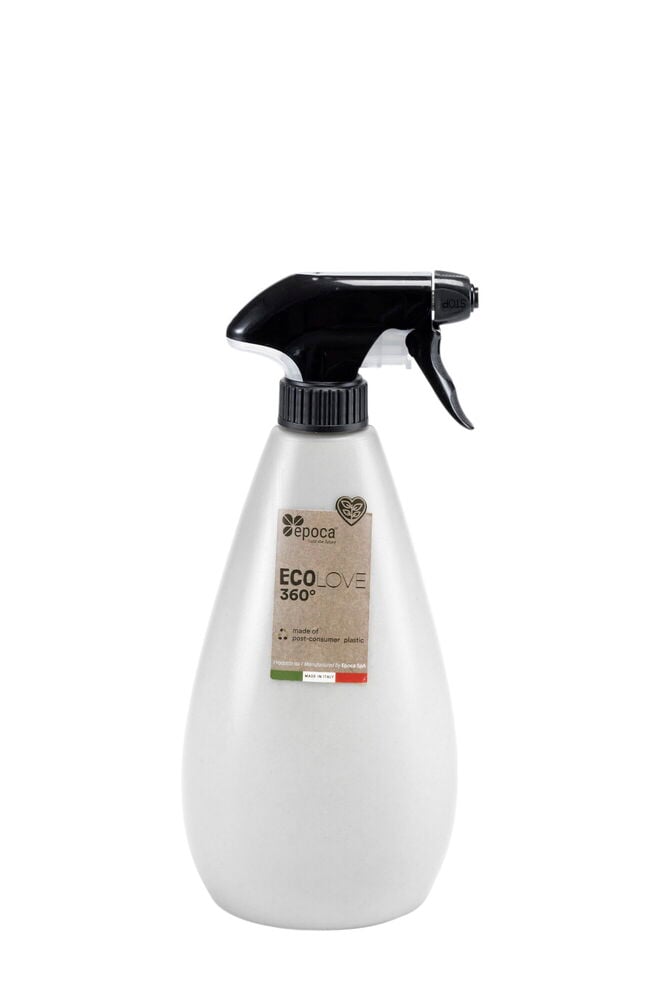 Valkoinen suihkepullo mustalla suuttimella ja etiketillä.