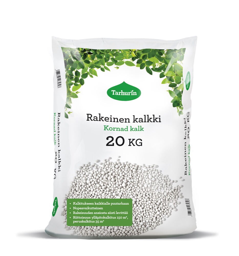 Valkoinen muovipussi, jossa rakeista kalkkia, vihreitä yksityiskohtia.