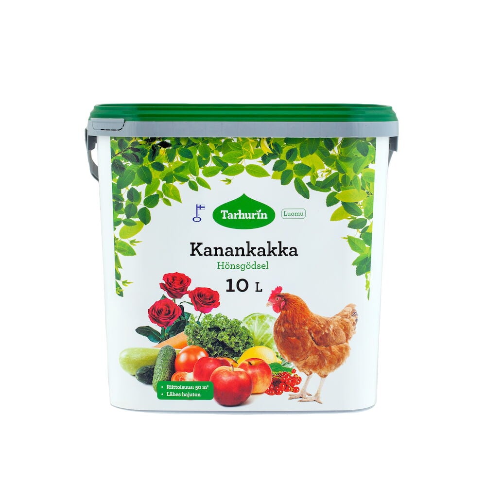 Valkoinen ämpäri vihreällä kannella, kukko ja vihannekset edessä.