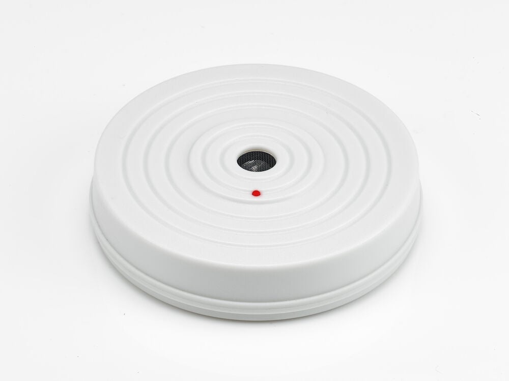 Valkoinen pyöreä elektroninen hiiri- ja rottaloukku, jossa on ilmaisin.