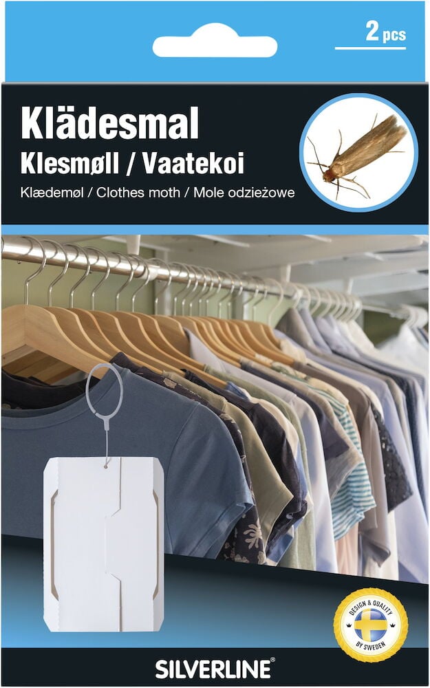 Kaksi valkoista vaatekoitarkoitusta varten tarkoitettua ansaa vaatekaappiin.