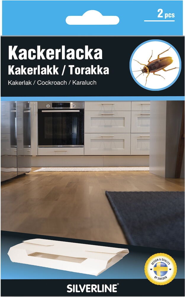 Kaksi valkoista torakkapyydystä keittiöympäristössä.