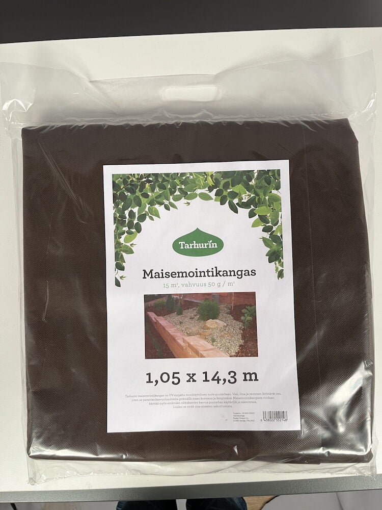 Painotettu suojakangas läpinäkyvässä muovipakkauksessa.