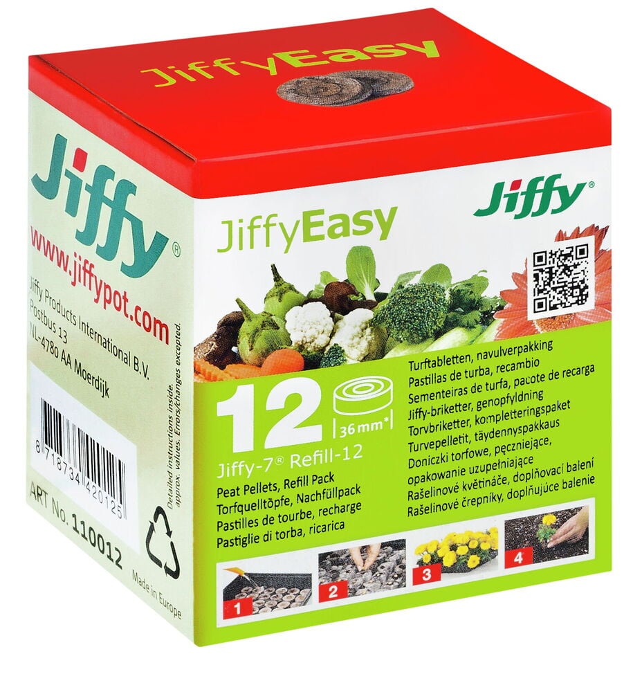 Monivärinen laatikko, jossa on Jiffy-turvetabletteja istutusta varten.