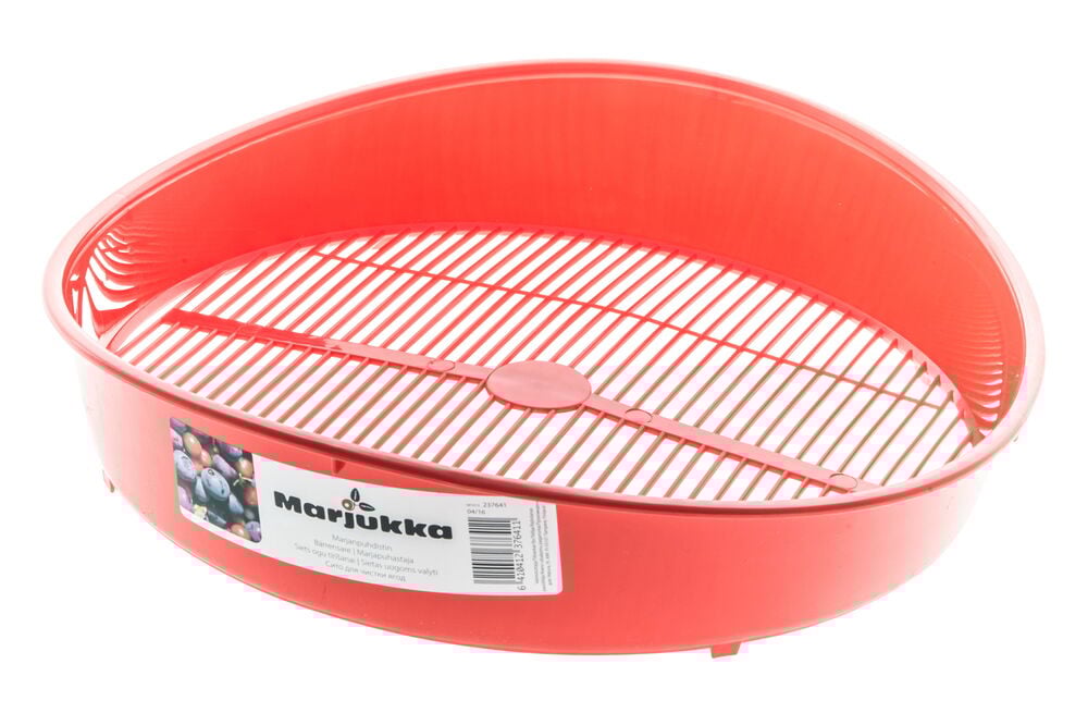 Punainen ovaali muovikori ritiläpohjalla.