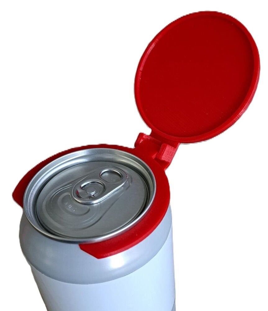 Punainen tölkin kansi alumiinitölkissä avonaisella kannella.