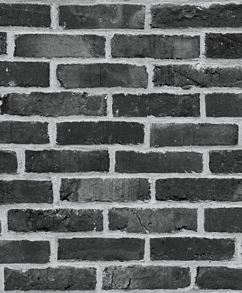 Svart tegelmönstrad tapet med murstensstruktur.