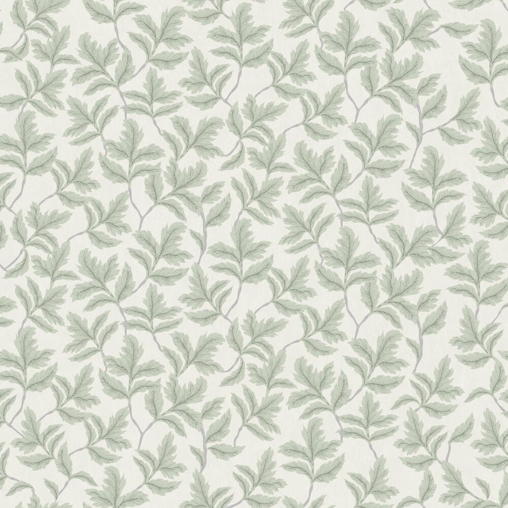 Grön tapet med grenmönster mot ljus bakgrund.