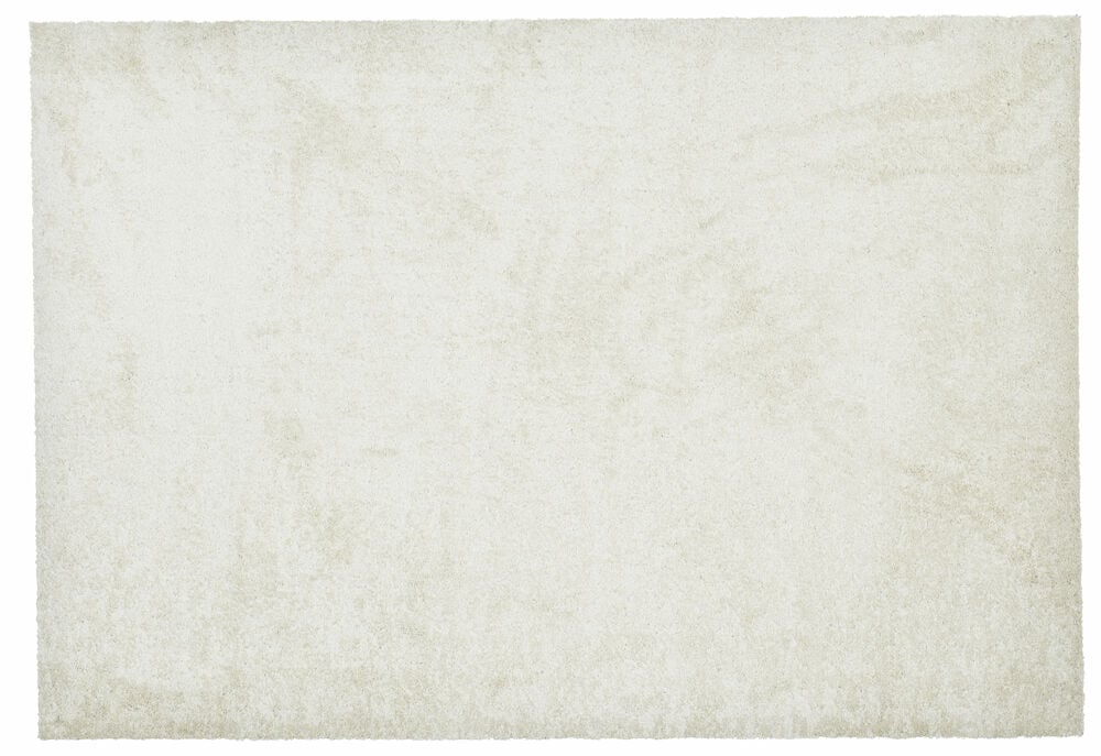 Lys rektangulært teppe med kort lugg.