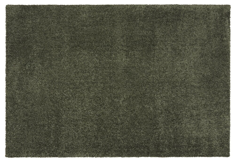 En grønn rektangulær matte med kort lugg.