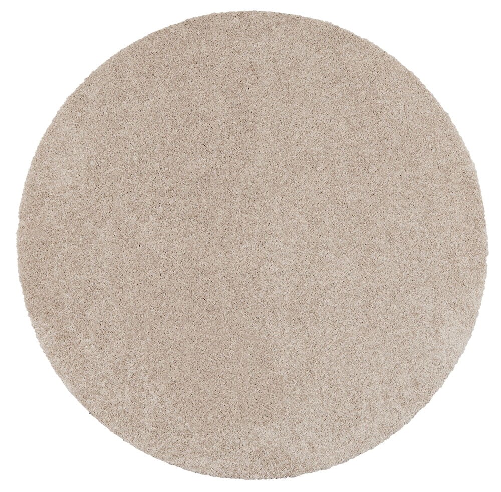 Pyöreä beige matto, jossa on lyhyt nukka.