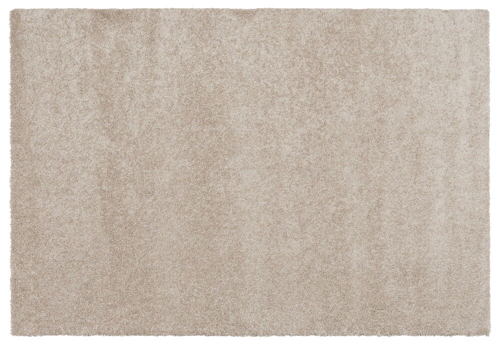 Suorakulmainen beige matto, jossa on pehmeä pinta.