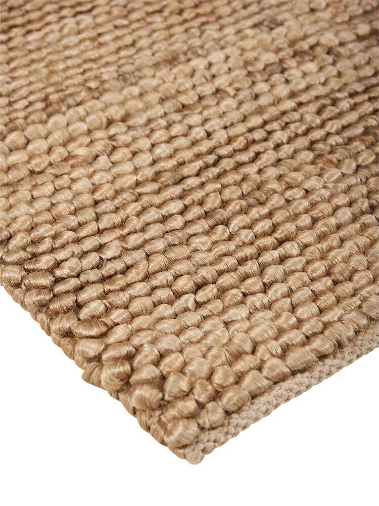 Närbild av naturlig bollmatta i jute och bomull.