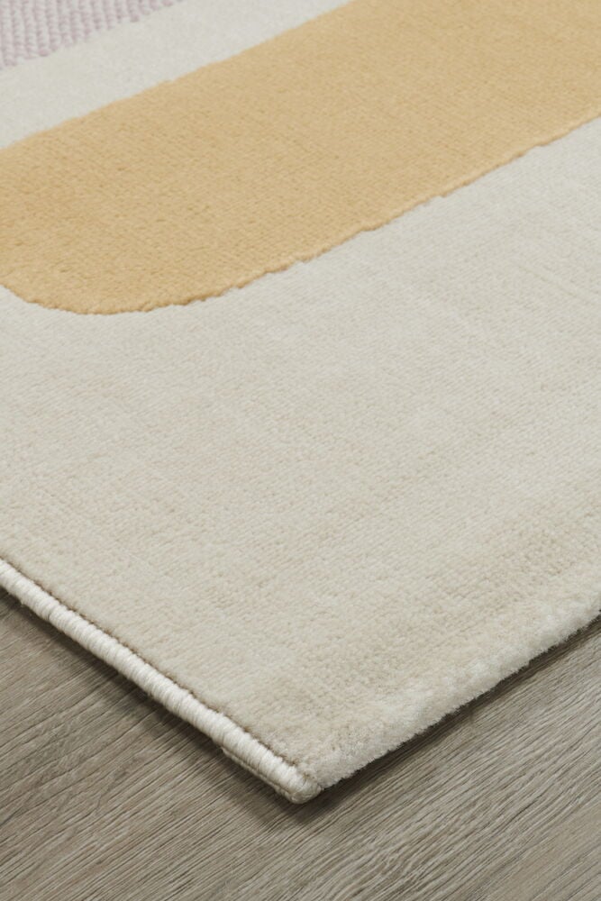 Hörnet av multifärgad matta med pastellfärger.