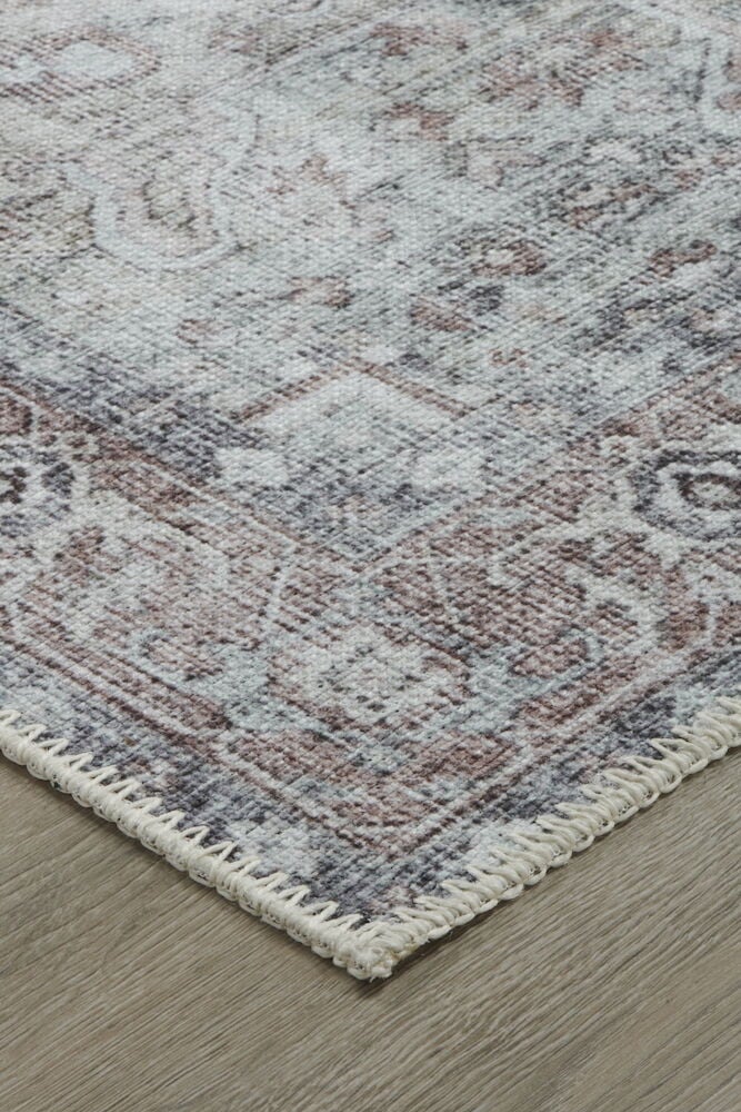 Multifärgad luggfri matta med klassiskt mönster.