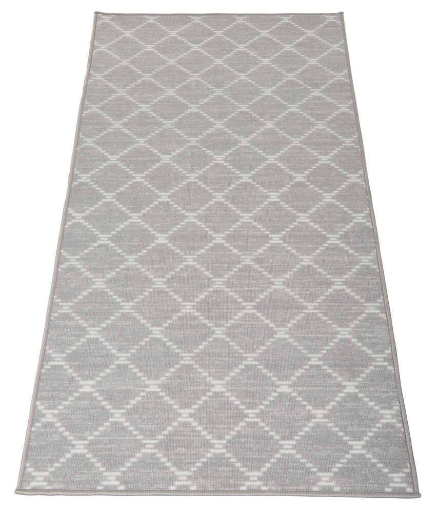 Grå gångmatta med mönster, rektangulär form.