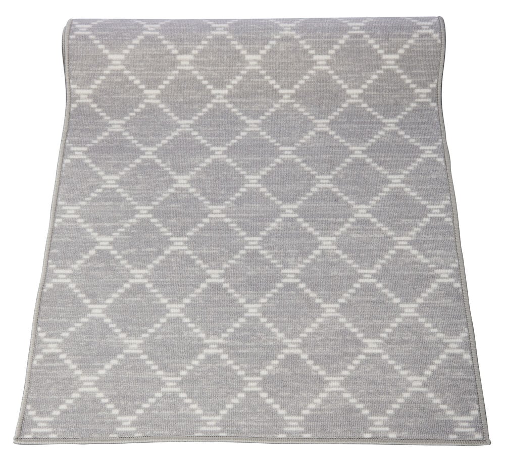 Harmaa käytävämatto, jossa on valkoisten ruutujen kuvio.