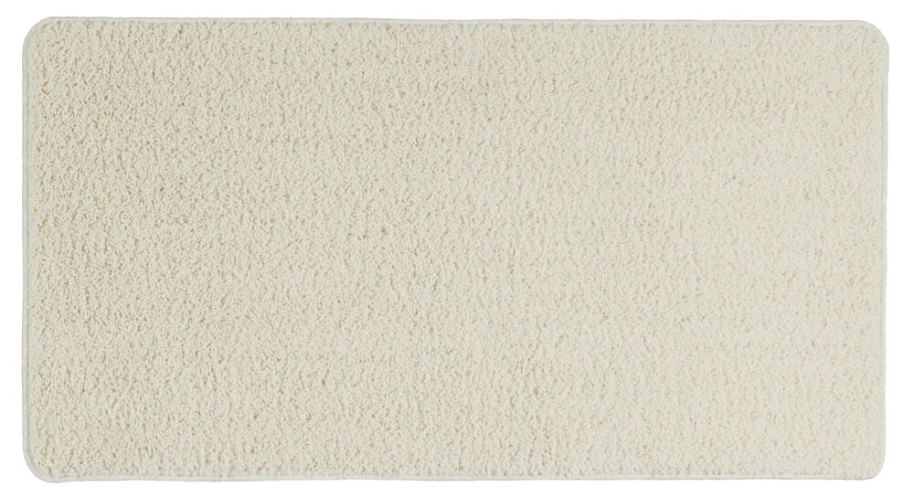 Valkoinen suorakulmainen käytävämatto, jossa on pehmeä rakenne.
