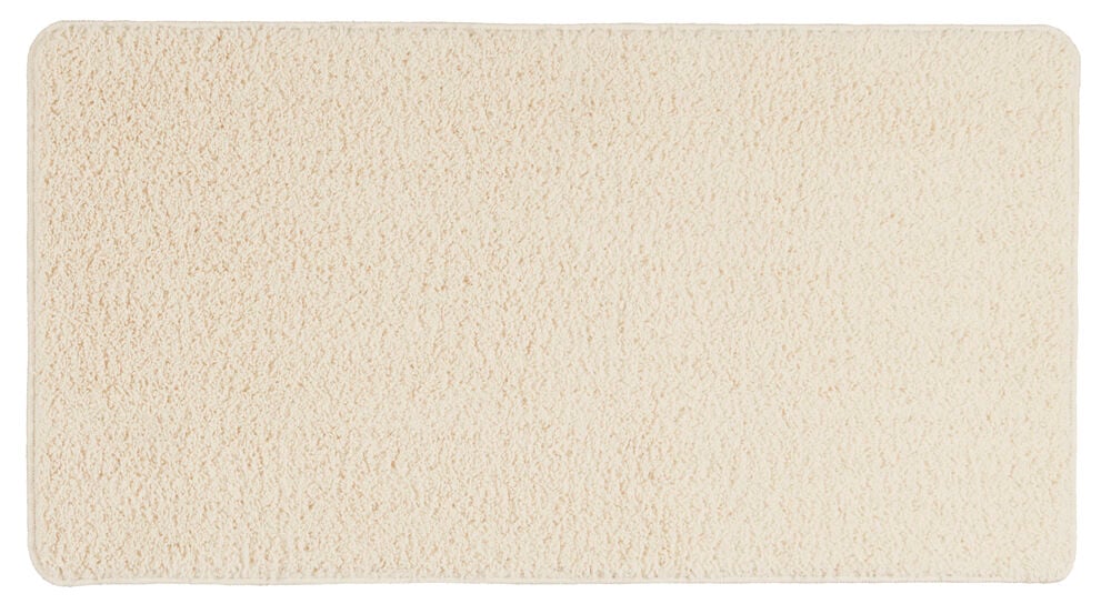 Weißer Polypropylen Läufer Tilda, rechteckig mit abgerundeten Ecken und einer zotteligen Textur.
