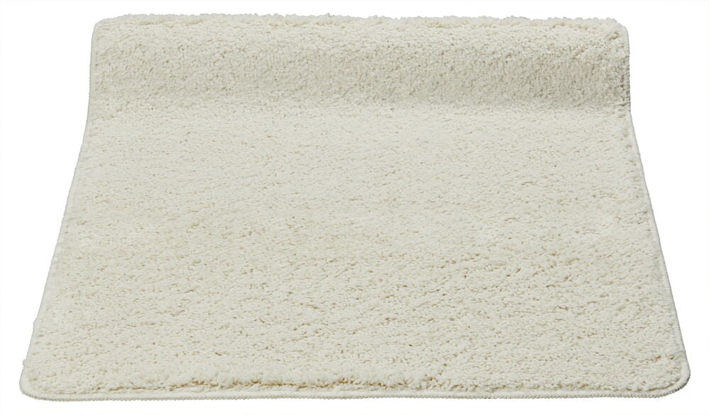 Valkoinen, rektangulaarinen, nukallinen käytävämatto.