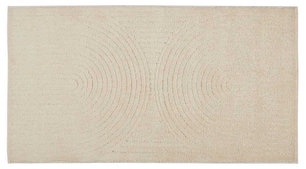 Ljus gångmatta med rundat mönster och slät yta.