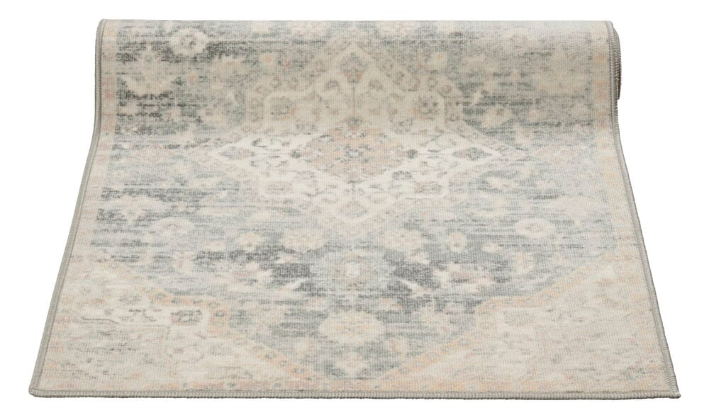 Harmaa käytävämatto, jossa on itämainen kuvio ja patina.